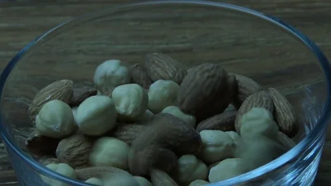 Almonts and nuts fall into cup Stock Footage 79559903