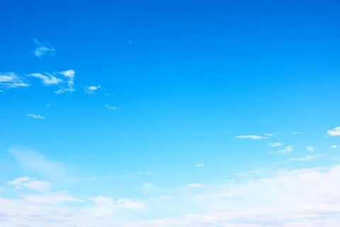 Almost clear blue sky with light clouds Stock Photos