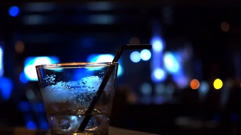 Almost empty drink glass in night club Stock Footage 89160292