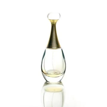 Almost empty perfume bottle isolated on white background with reflection Stock Photos