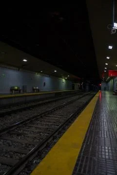 Almost empty underground train station. Platform without passengers. Stock Photos