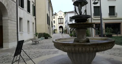 Almost empty university square with a big decorative stone fountain with water Stock Footage 150154259