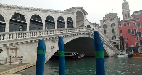 Almost empty water bus shuttle passing under Rialto Bridge on grand canal fog Stock Footage 150387064