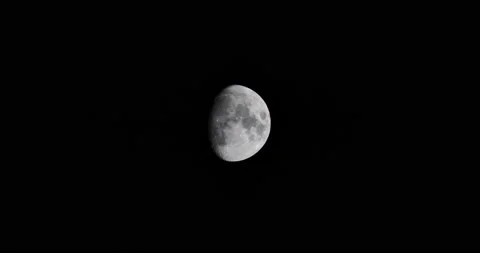 Almost full moon bright in the night sky shining over the Earth Stock Footage 218412848