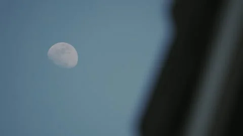 Almost full moon next to building Stock Footage 308907760