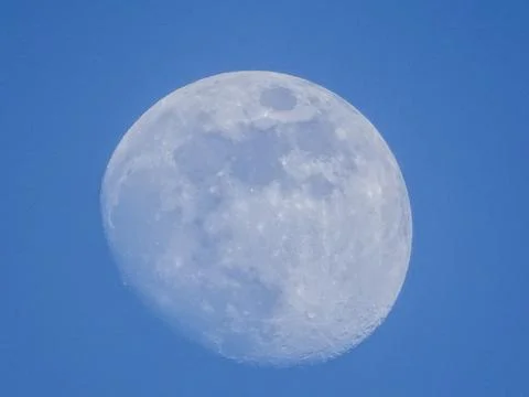 Almost full moon seen during the day Stock Photos