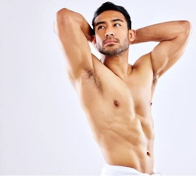 Almost ready to enter the competitions. a man posing in his underwear against a Stock Photos