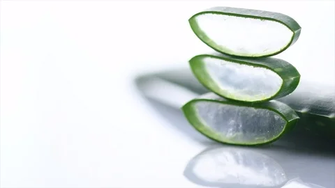 Aloe Vera sliced leaf on white, natural renewal cosmetics, alternative medicine Stock Footage 99471052