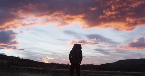 Alone with backpack during pink sunrise Stock Footage 90080321
