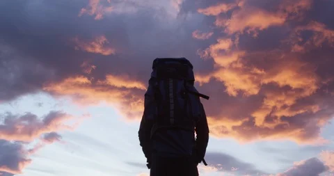 Alone with backpack during pink sunrise Stock Footage 90080413