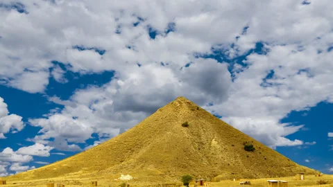 Alone conical mount top on blue cloudy sky background Stock Footage 157300510