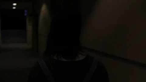 Alone in a hallway at night Stock Footage 79337845