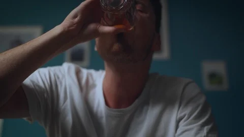Alone man alcoholic drinking alcohol from glass at home Stock Footage 113040746