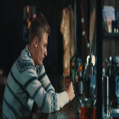 Alone man drinks alcohol vodka shot at bar counter 4k video in pub. 库存影片 69377620