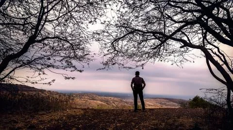 Alone man on the hill Stock Photos