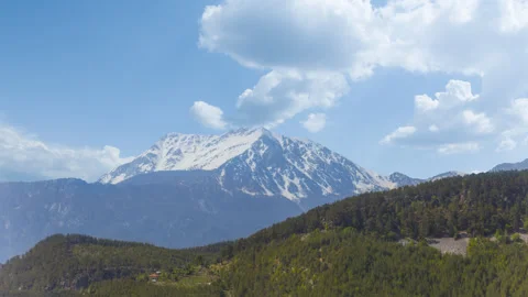 Alone mount peak in snow under dense cloudy sky Stock Footage 255120513