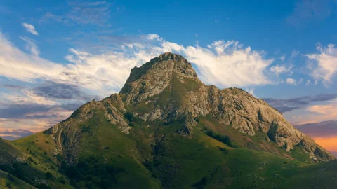 Alone mount top on the red dramatic sunset background Stock Footage 258300496