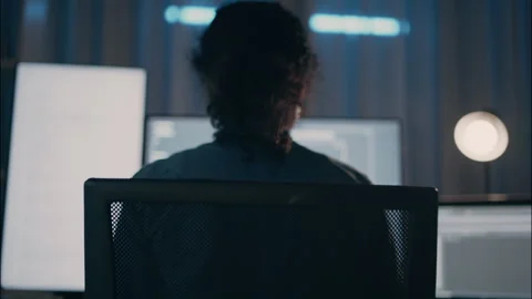 Alone Programmer Working at Night in Front of Multiple Screens. Stock Footage 307586753