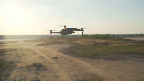 Alone quadrocopter flying upon a desert slow motion Stock Footage 75542506
