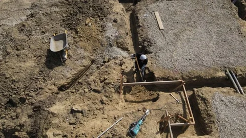 Alone shoveling dirt at a construction yard Stock-Footage 228794850