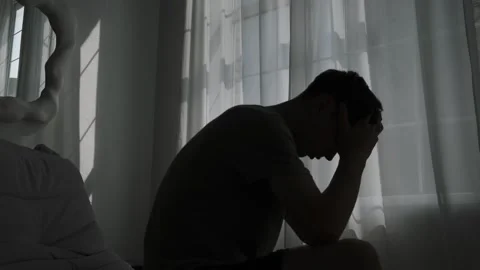 Alone in silence, a man confronts inner demons, facing mental health issues and Stock Footage 311763035