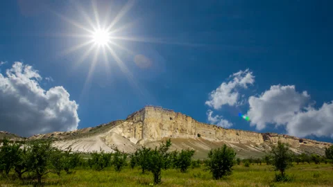 Alone white mount under a sparkle sun Video stock 317757095