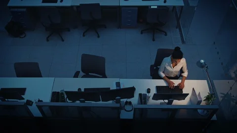 Alone Working Late at Night in the Office: Businesswoman Using Desktop Computer Stock Footage 106534710