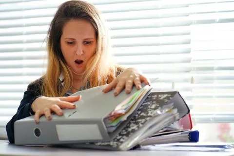 Alone working in office with a lot of documents. Yelling and screaming for ba Stock Photos