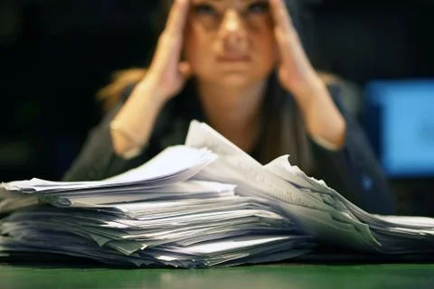 Alone working in office with a lot of documents. Yelling and screaming for ba Stock Photos
