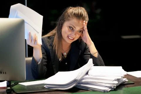 Alone working in office with a lot of documents. Yelling and screaming for ba Foto stock