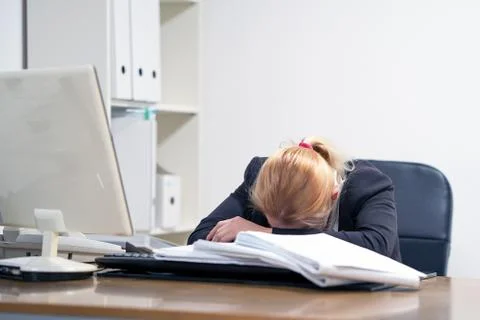 Alone working in office with a lot of documents. Yelling and screaming for ba Stock Photos