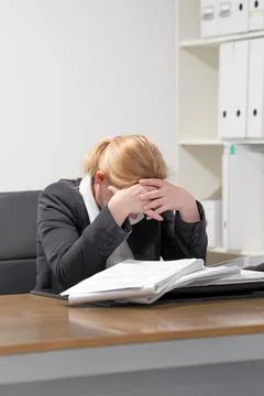 Alone working in office with a lot of documents. Yelling and screaming for ba Stock Photos