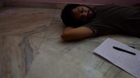Alone writer sleeping after writing letter to nature in the pendemic and 스톡 동영상 137679971