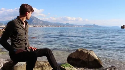 Alone Young Man Looking to Mediterranean Ocean Stock Footage 83267388