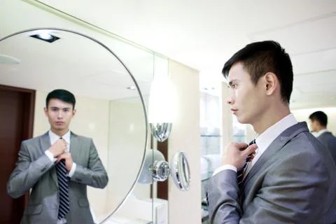 Alone Young men Adjustment White-collar workers Luxx Asians The Blue Man of the Stock Photos