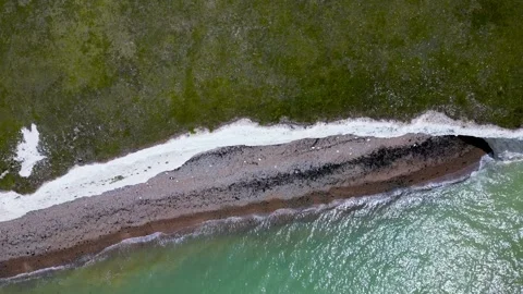 Along cliff edge with sea below, sohrline, Sussex UK Stock Footage 246388444