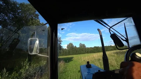 Along the forest on a tractor Stock Footage 114069135