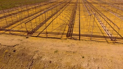 Along the frames of greenhouses Stock Footage 109375429
