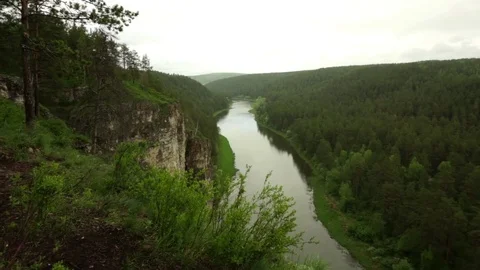 Along river and cliff and forests on Ural Stock Footage 76273105