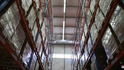 Along warehouse shelves Stock Footage 72665034