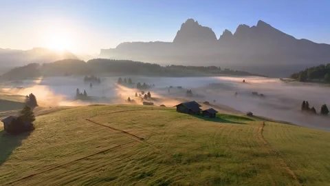 Alpe di Siusi (Backward Drone Shot) 06 | Sunrise | Italian Dolomites | Fog | 4K Video stock 259923331