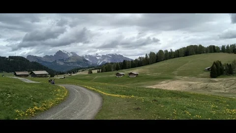 Alpe di Siusi, Itali - 05,28,2025: Mountain huts in Alpe di Siusi, panning left Video stock 313351053