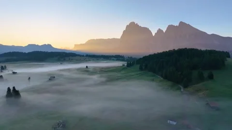 Alpe di Siusi (Sideways Drone Shot) 06 | Sunrise | Italian Dolomites | Fog | 4K 動画素材 259923814