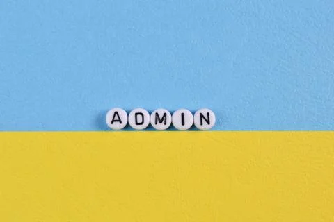 Alphabet beads with text ADMIN isolated on blue and yellow background Foto stock