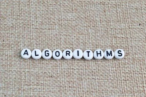 Alphabet beads with text ALGORITHMS. Top view Stockfoto's