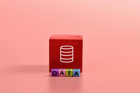 Alphabet beads with text DATA and wooden block with data symbol. Stock Photos
