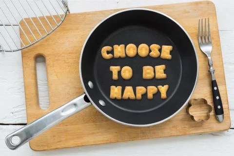 Alphabet biscuits quote CHOOSE TO BE HAPPY kitchenware Stock Photos