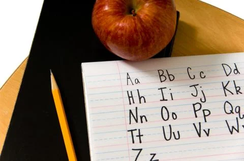 Alphabet on desk Stock Photos