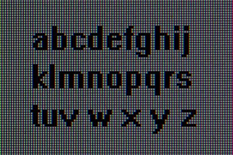 Alphabet, macro pixels Stock Photos