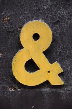 Alphabet &amp; on a rustic metallic sheet. 스톡 사진
